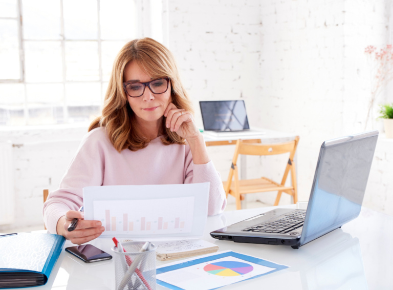 business-woman-reviewing-charts-pie-graphs