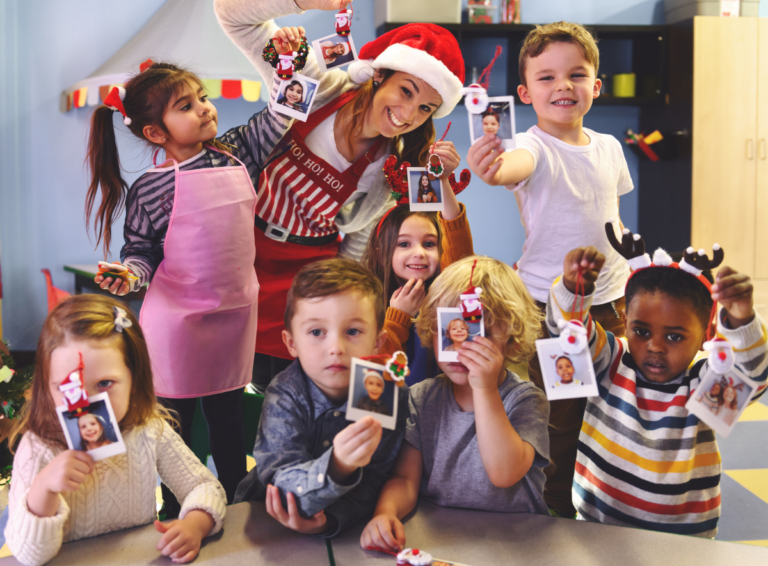 Children and teacher with holiday crafts at daycare center