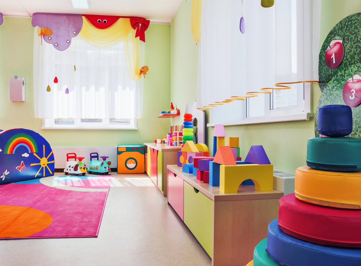 Child care center room with bright colors and toys