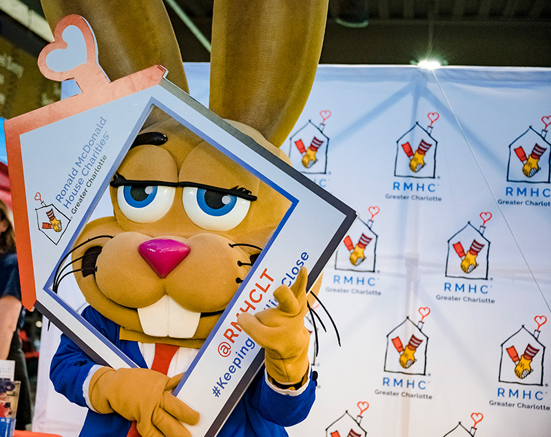 zippy holding ronald mcdonald house sign