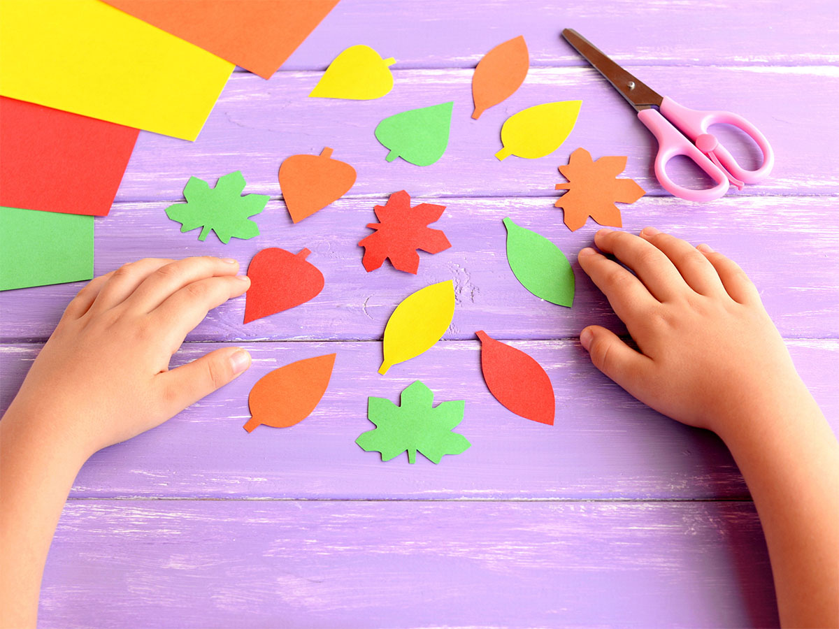 Child care center fall activity with leaves