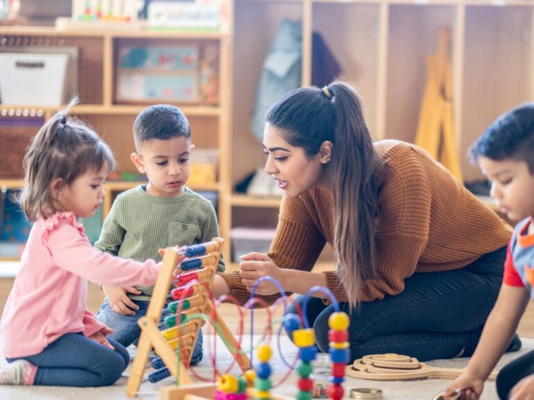 A Teacher helps a student learn basic math with toys